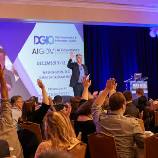 session attendees raising their hands in participation