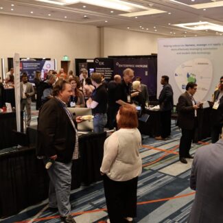 attendees speaking to people at booths