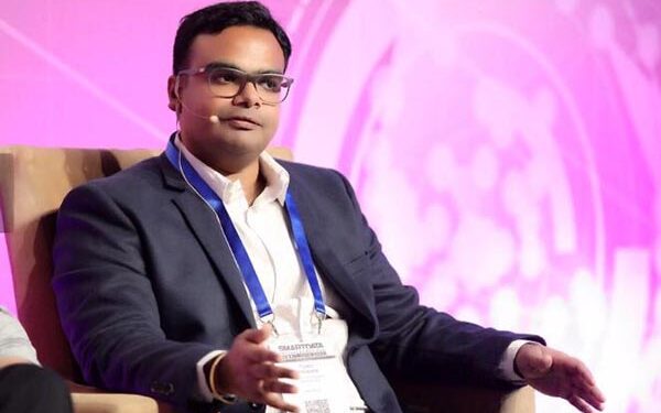 Tejasvi Addagada speaking on a panel